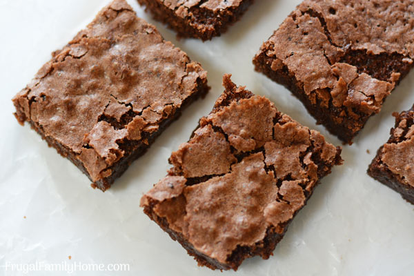 A few easy homemade brownies ready to serve on a plate.