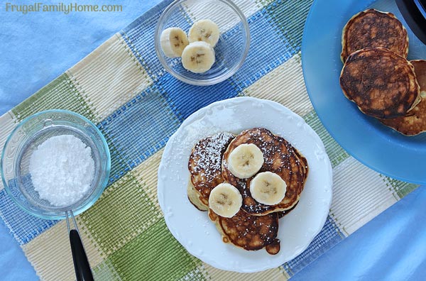 The easy banana bread pancakes on a plate ready to eat.