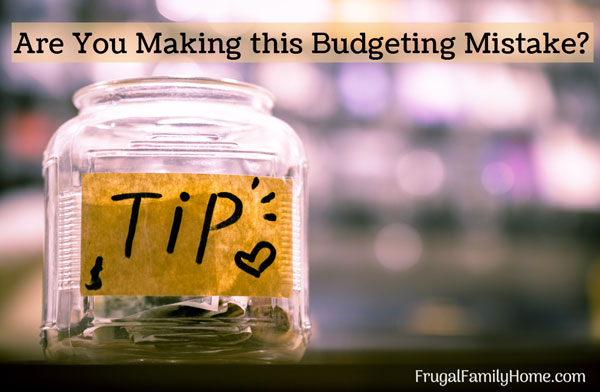 Budget tips jar on a desk.