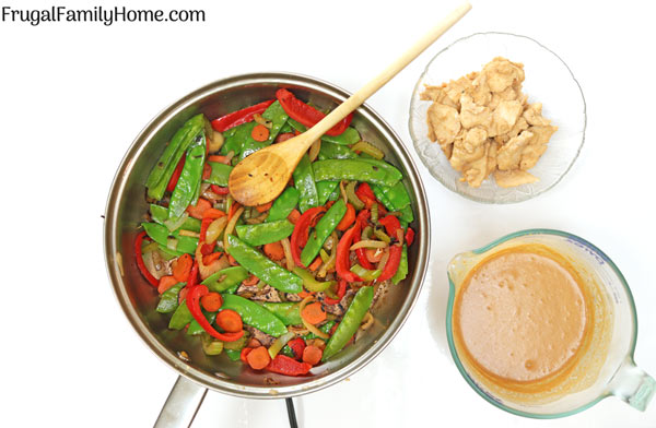 Skillet with stir fried vegetables, chicken and Thai Chicken sauce