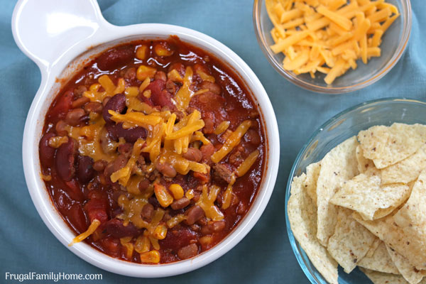 A serving of slow cooker taco soup with chips