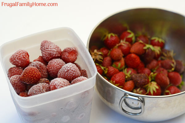frozen strawberries in a freezer container