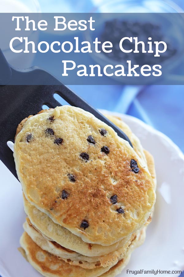 Placing a chocolate chip pancake on a stack.