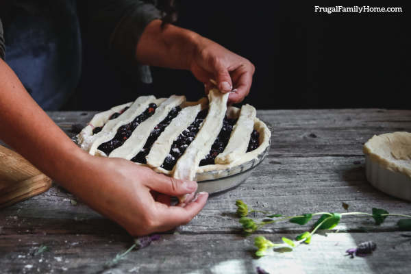 Placing the lattice top on the pie.