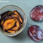 Prunes, or dried plums in a jar for storage.