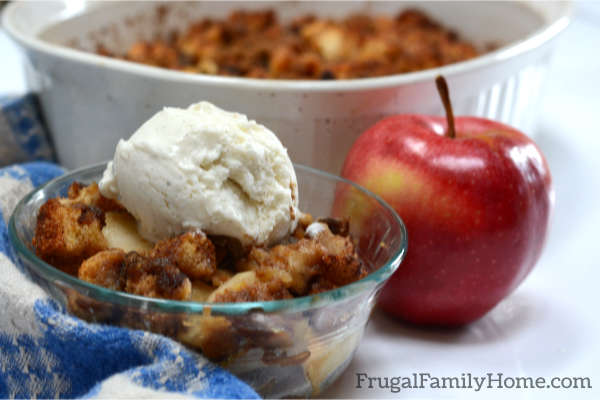 A serving of apple brown betty with ice cream.