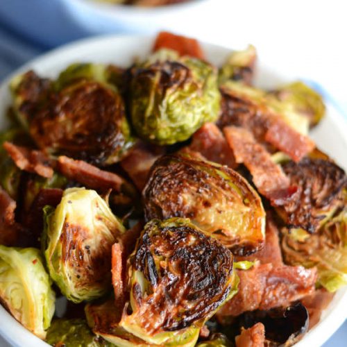 A bowl of brussel sprouts with bacon