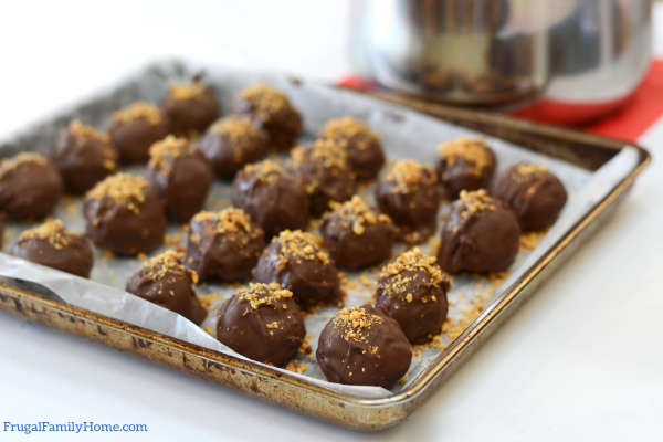 Truffles on the cookie sheet setting.