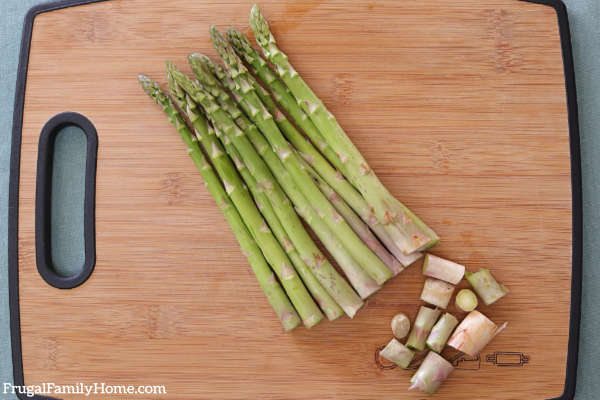 cutting asparagus ends off.