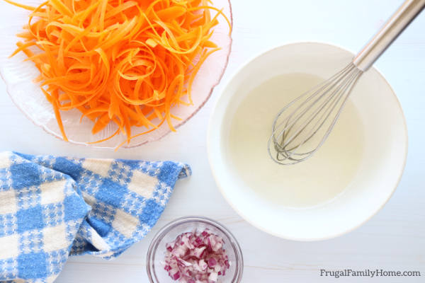 mixing the dressing for the salad.