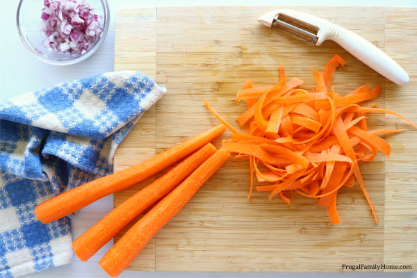 peeling the carrots in to ribbons