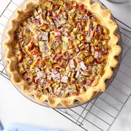 the rhubarb custard pie on cooling rack.