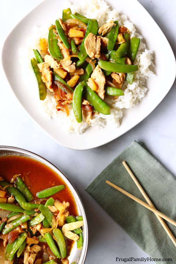 A serving of the chicken stir fry with peas and pineapple.