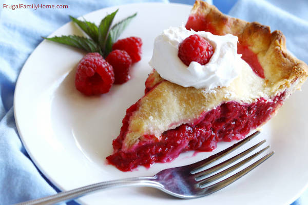 a slice of raspberry pie on a plate