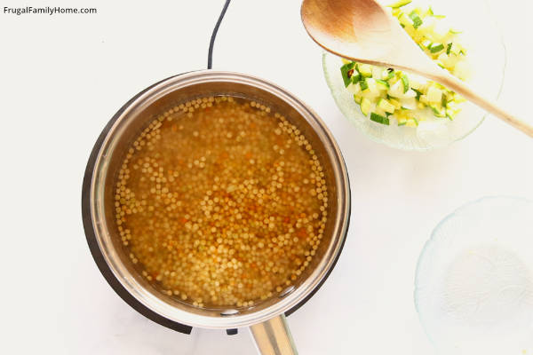 the couscous cooking in the pan