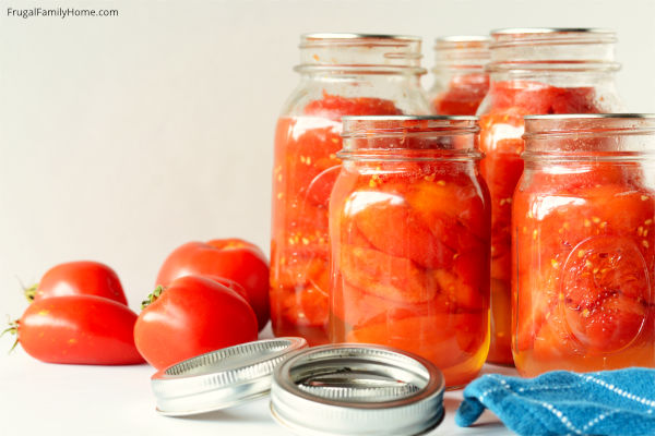 Tomatoes canned cooled and rings removed from jars.