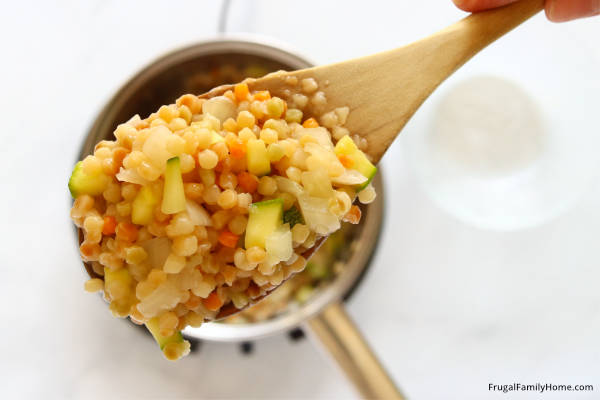 the cooked vegetable couscous on a spoon