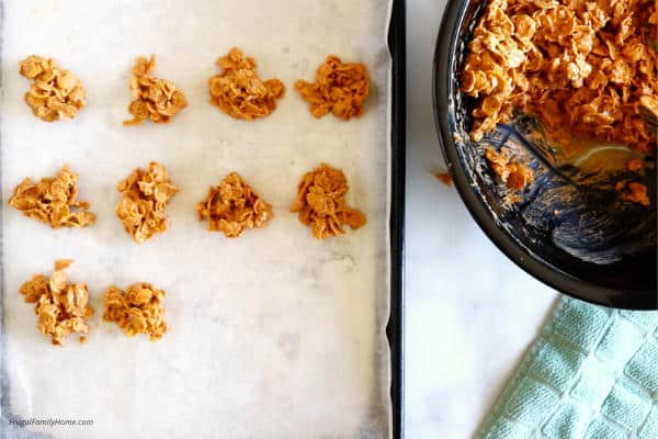 cornflake cookies on cookie sheet setting up.