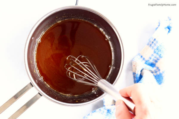 stirring the sugar into the homemade pancake syrup.