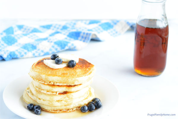 pancakes with vanilla pancake syrup recipe beside them.