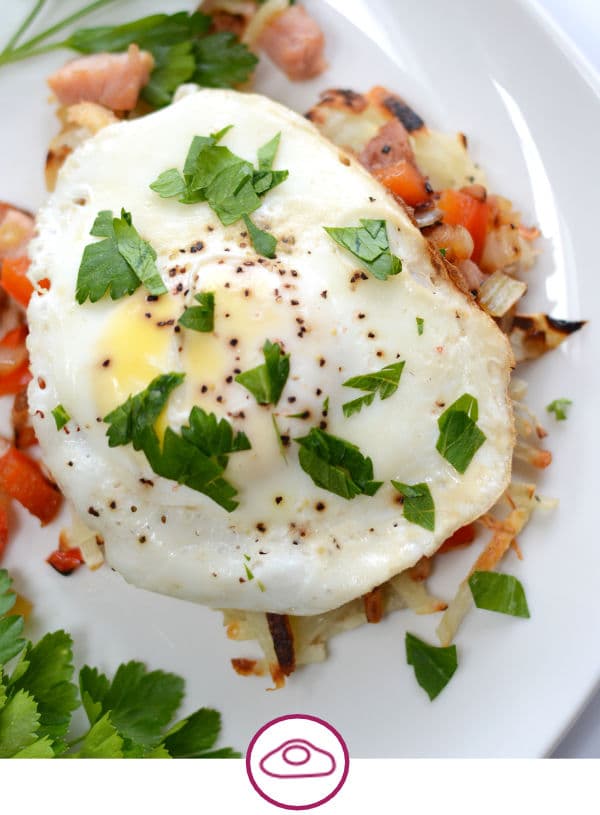 a poached egg atop vegetables