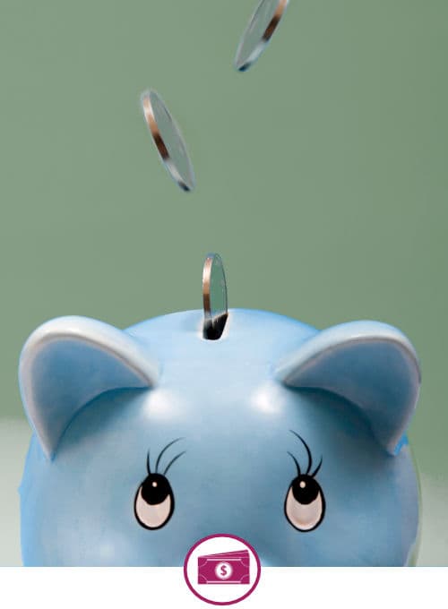 Blue piggy bank with coins being dropped in