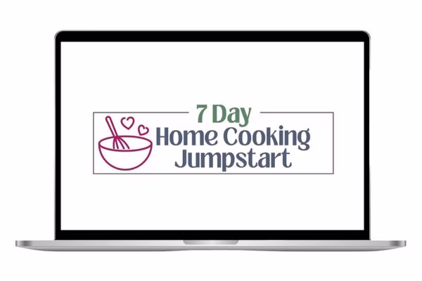 A laptop with the 7 day home cooking jumpstart challenge ready to go.