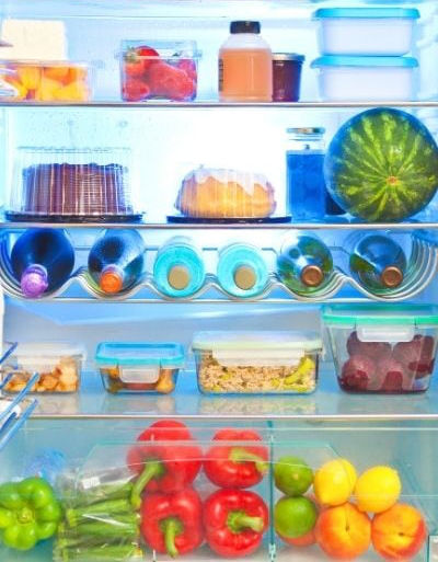 Refrigerator full of food and ready to cook dinner.